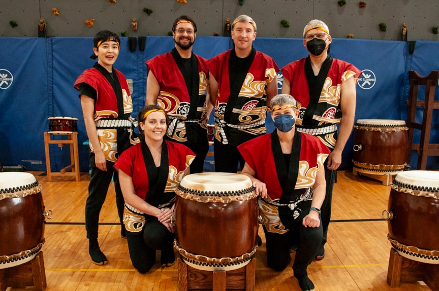 Pittsburgh Taiko members posed with drums at a community performance. Photo by Mary Jane Bent.